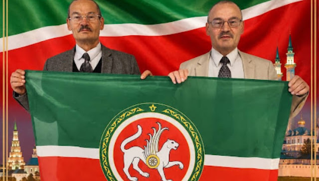 Rafis and Nafis Kashapov hold the Tatarstan flag.